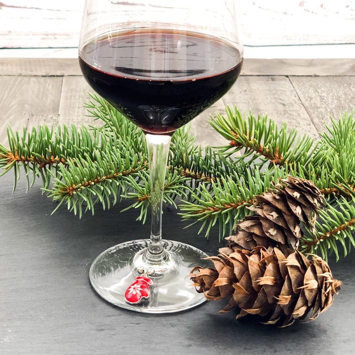 https://corknleaf.com/cdn/shop/products/christmas-holiday-wine-glass-charms-set-of-8-881019.jpg?v=1633749646